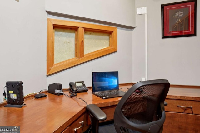 home office featuring built in study area