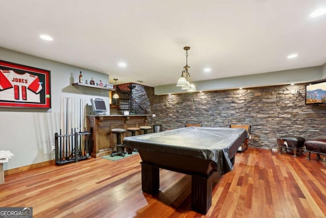 game room with pool table, recessed lighting, wood finished floors, and bar