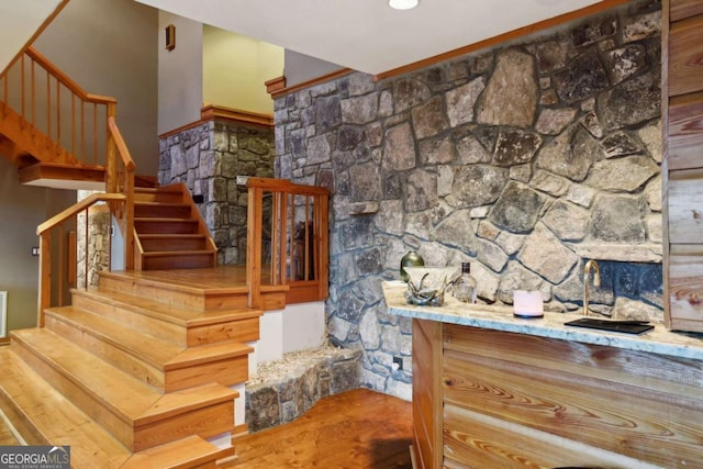 stairs featuring visible vents and wood finished floors