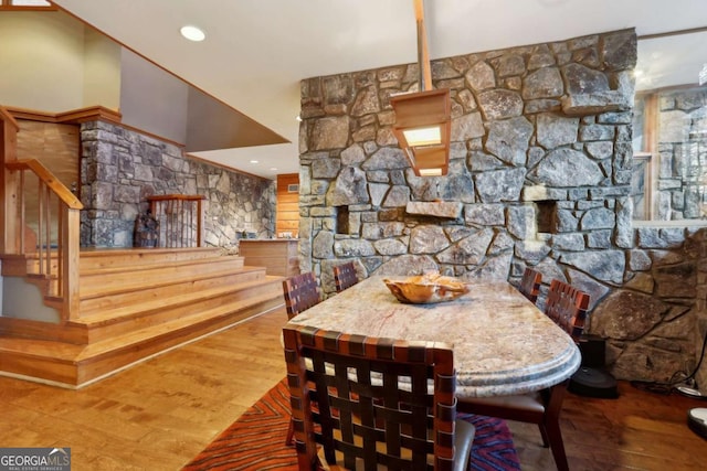 dining area featuring wood finished floors and recessed lighting