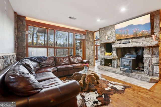 living area with wood finished floors and visible vents