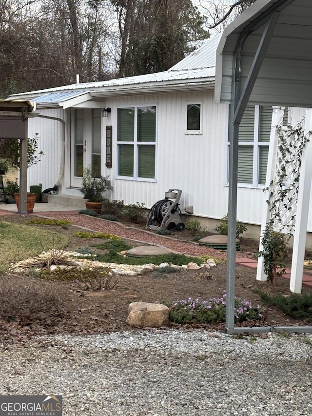 exterior space featuring metal roof