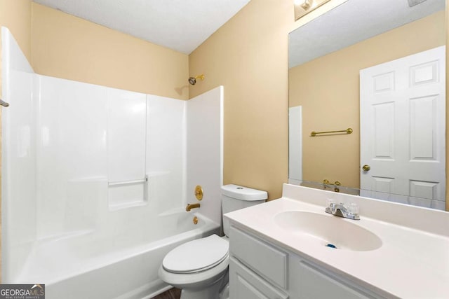 bathroom featuring toilet,  shower combination, and vanity