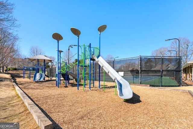 communal playground featuring fence