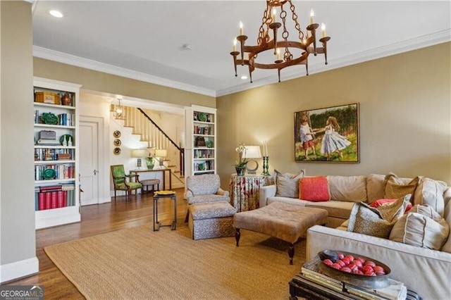 living room featuring recessed lighting, wood finished floors, ornamental molding, stairway, and an inviting chandelier