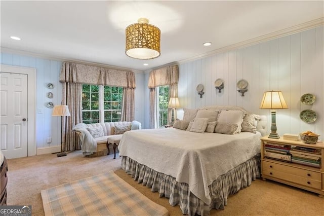 carpeted bedroom featuring crown molding