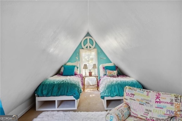 bedroom with vaulted ceiling and carpet flooring