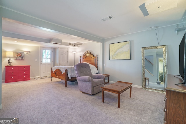 carpeted bedroom featuring visible vents and baseboards