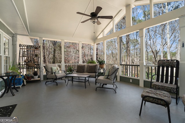 sunroom featuring vaulted ceiling, ceiling fan, and a healthy amount of sunlight