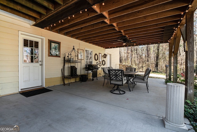 view of patio / terrace with outdoor dining space, ceiling fan, and area for grilling