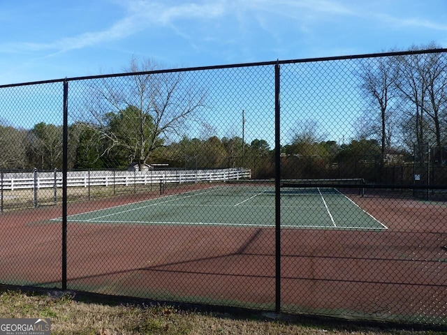 view of sport court with fence