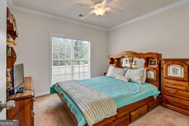 bedroom featuring baseboards, visible vents, crown molding, and light colored carpet