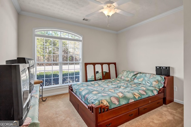 carpeted bedroom with baseboards, a textured ceiling, visible vents, and crown molding