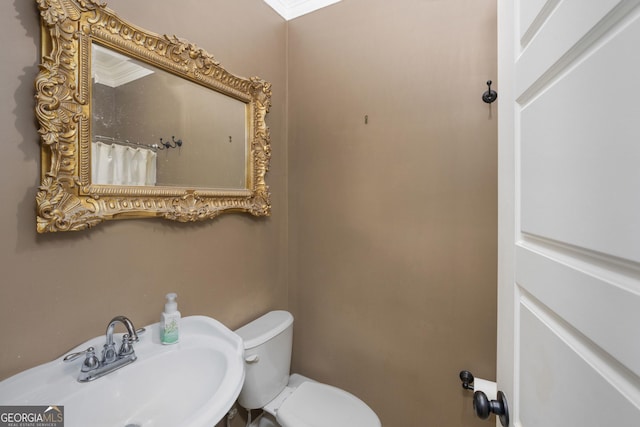 bathroom with a sink and toilet