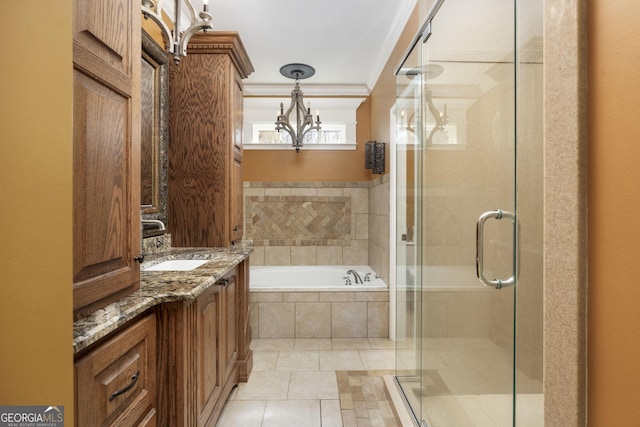 bathroom with a garden tub, vanity, ornamental molding, tile patterned floors, and a stall shower