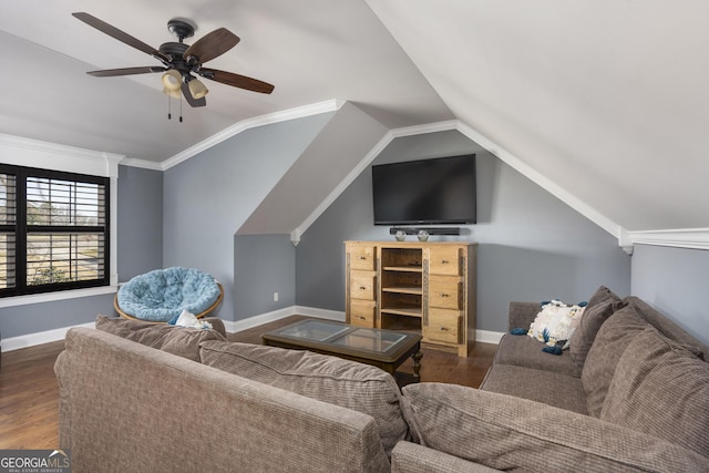 living room with ceiling fan, vaulted ceiling, baseboards, and wood finished floors