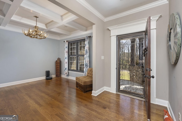 foyer with a wealth of natural light, baseboards, wood finished floors, and beamed ceiling