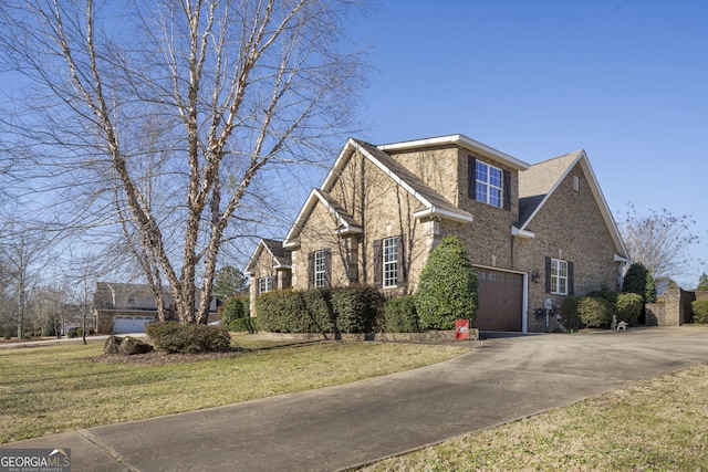 view of front facade featuring concrete driveway, brick siding, and a front yard