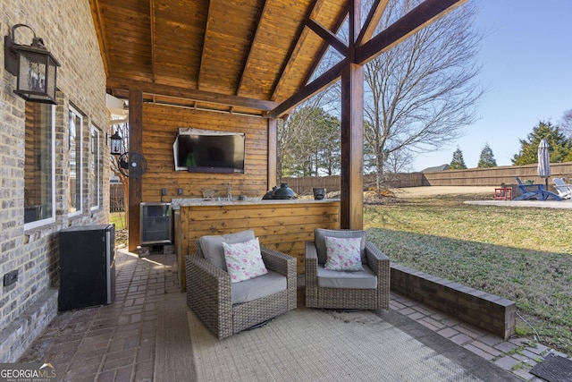 sunroom / solarium featuring wooden ceiling and lofted ceiling with beams