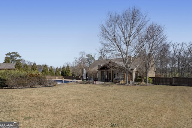 view of yard featuring a patio area and fence