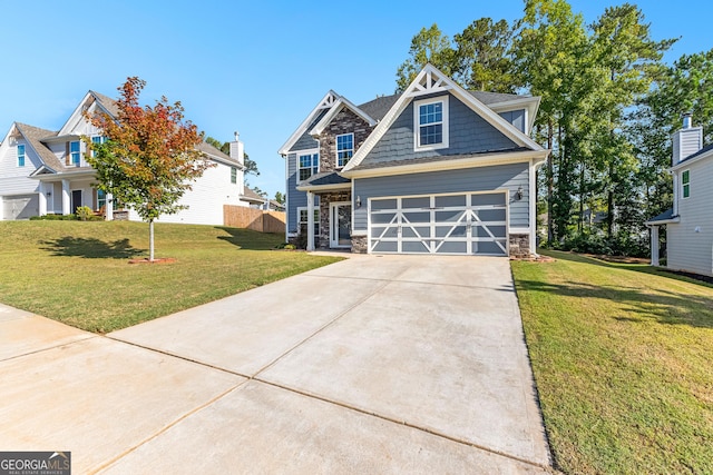 craftsman inspired home featuring a garage, stone siding, concrete driveway, and a front yard