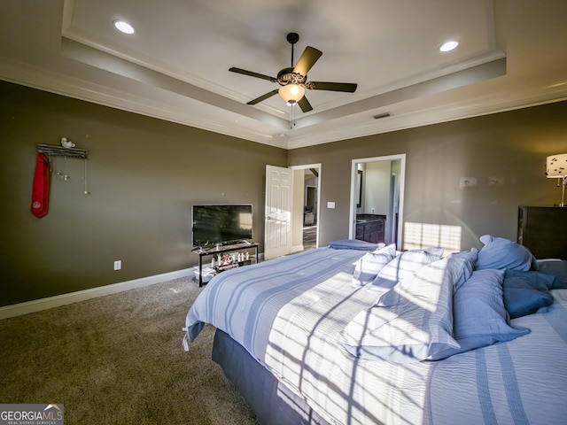 carpeted bedroom with baseboards, visible vents, a raised ceiling, and recessed lighting