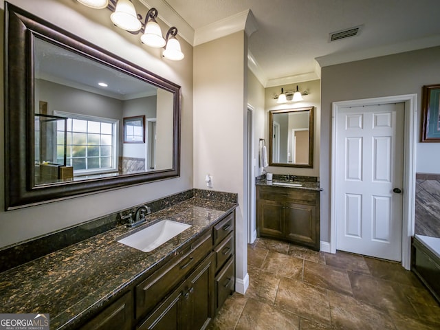 bathroom with ornamental molding, two vanities, a sink, and visible vents