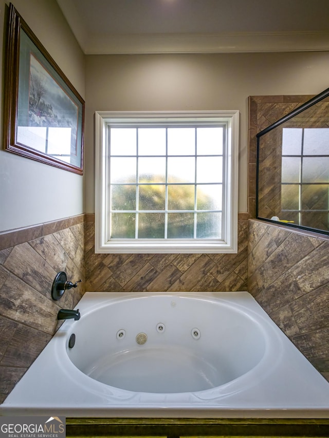 full bath with a whirlpool tub