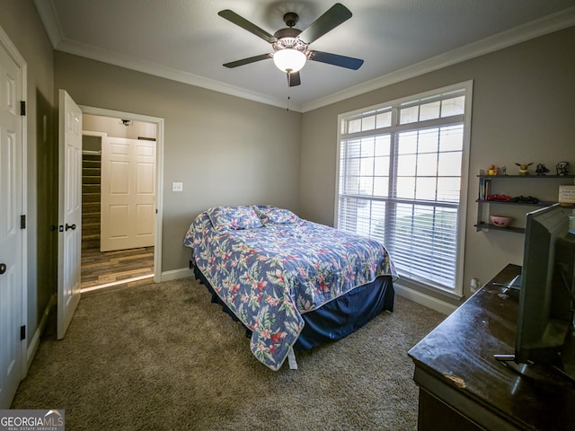 carpeted bedroom featuring ceiling fan, ornamental molding, and baseboards