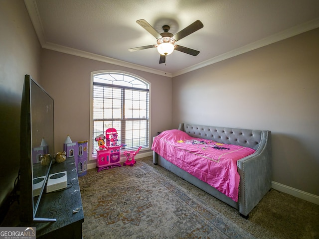 bedroom featuring carpet, baseboards, ceiling fan, and crown molding