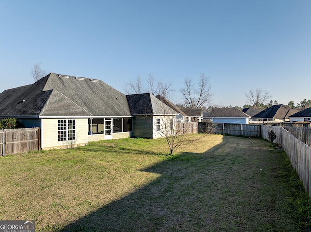 view of yard featuring a fenced backyard