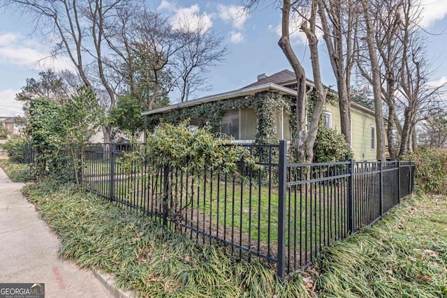 view of side of home with fence private yard