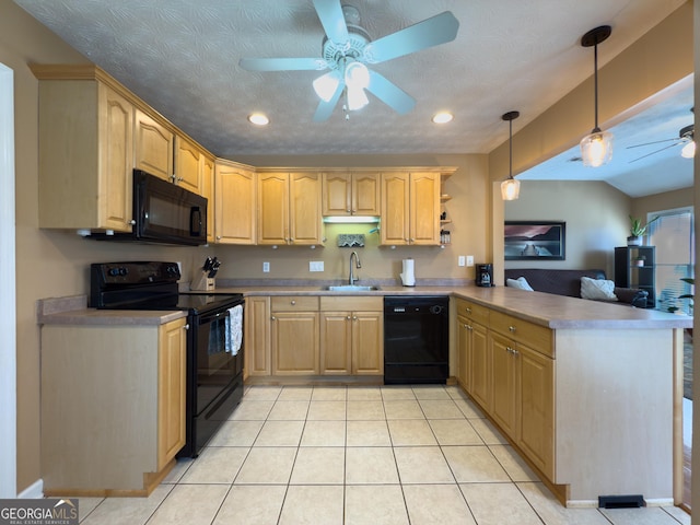 kitchen featuring light tile patterned floors, a ceiling fan, a sink, a peninsula, and black appliances