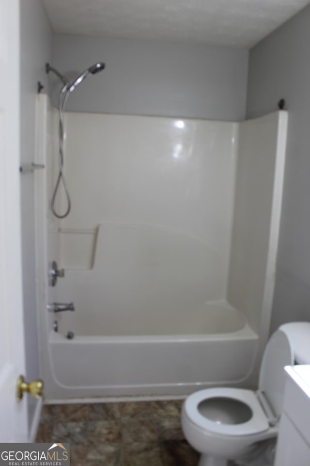 full bath with vanity, toilet, and shower / bathtub combination