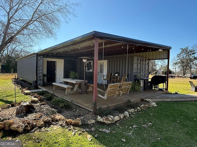 view of patio featuring grilling area and a wooden deck