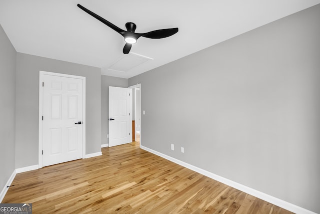 unfurnished bedroom featuring baseboards, ceiling fan, and light wood finished floors