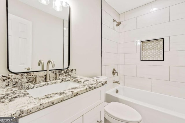 full bathroom featuring toilet, tub / shower combination, and vanity