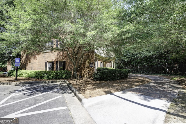 25309 Plantation Dr NE Unit 309, Atlanta, GA 30324 - view of front of home with uncovered parking and brick siding