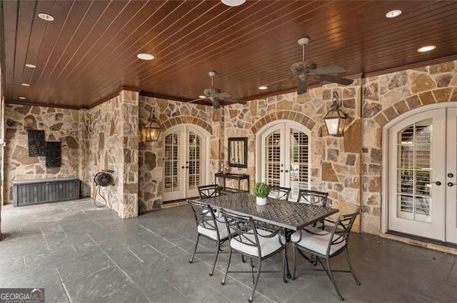 view of patio / terrace featuring french doors, outdoor dining space, and ceiling fan