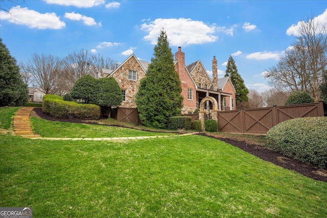 view of yard with a gate and fence