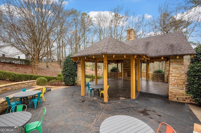 view of patio / terrace with a gazebo and outdoor dining area