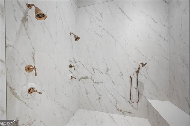 full bathroom with a marble finish shower
