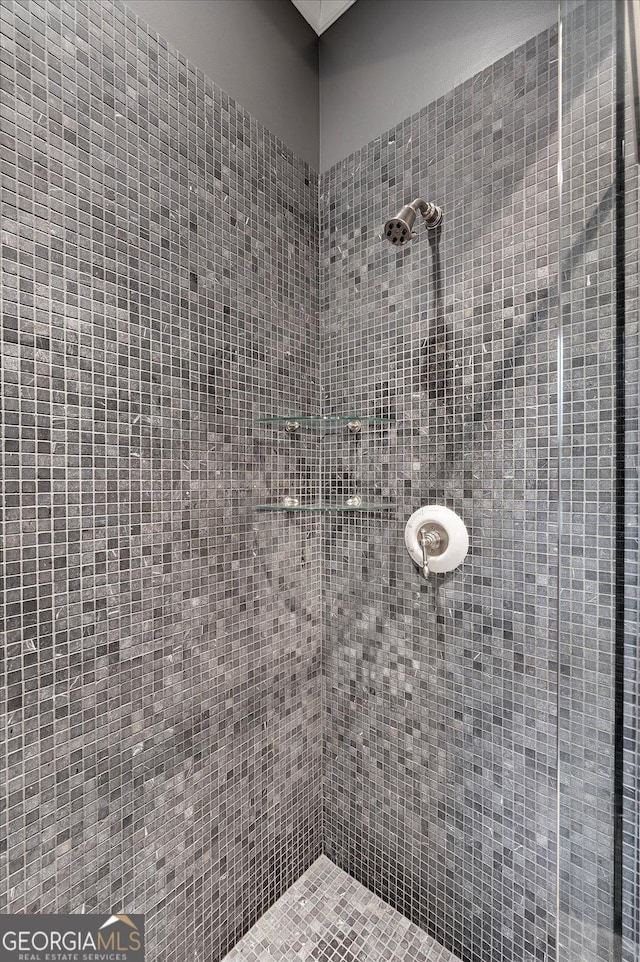 full bathroom with tiled shower