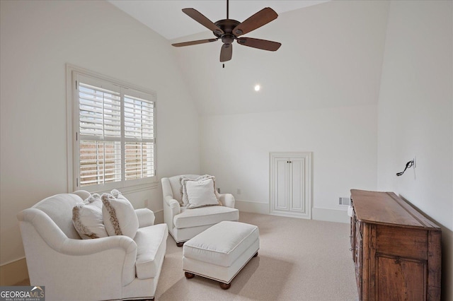 living area featuring visible vents, baseboards, lofted ceiling, ceiling fan, and carpet floors