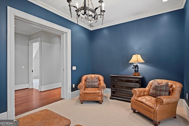 living area with carpet, baseboards, ornamental molding, and a chandelier