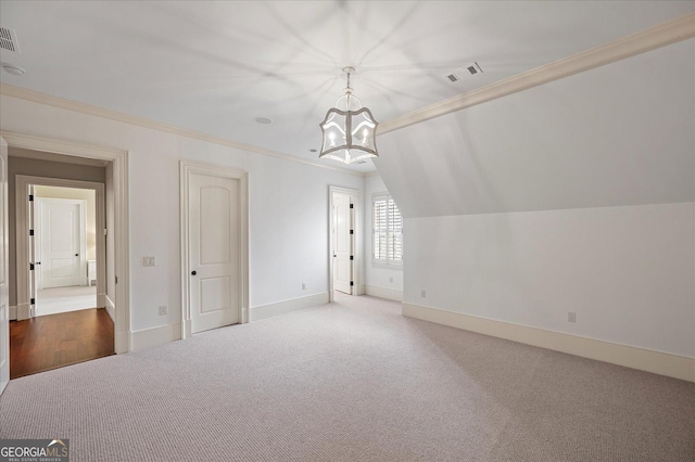 additional living space featuring baseboards, carpet floors, visible vents, and an inviting chandelier