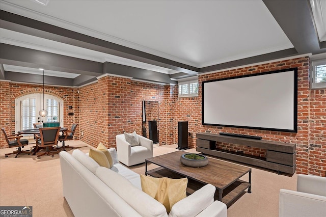 carpeted home theater with a healthy amount of sunlight and brick wall