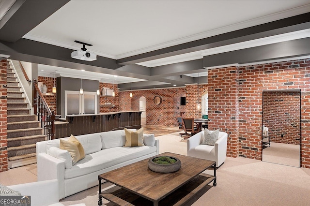 living area with brick wall, stairway, light colored carpet, and crown molding