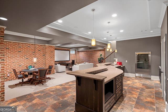 kitchen featuring brick wall, ornamental molding, open floor plan, and recessed lighting