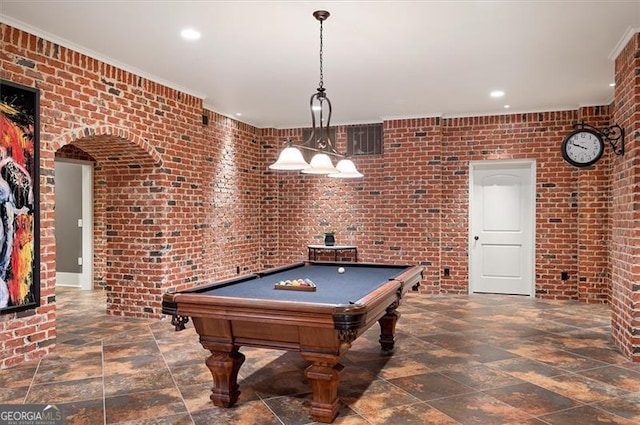 rec room with brick wall, recessed lighting, stone finish flooring, billiards table, and crown molding